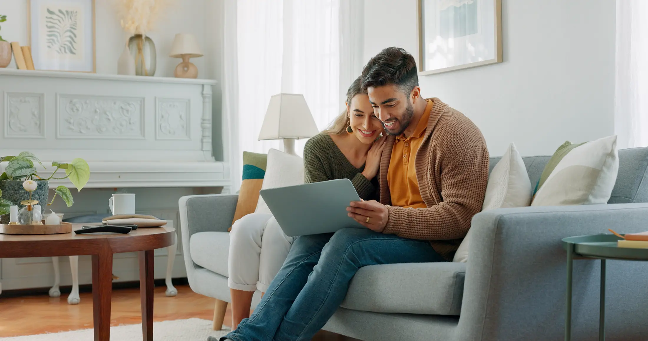 Man and woman at computer looking at mortgage rates