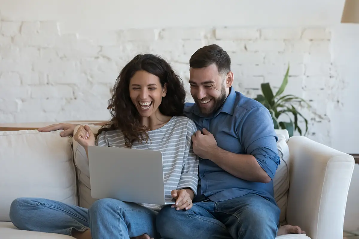 Man and woman searching on laptop
