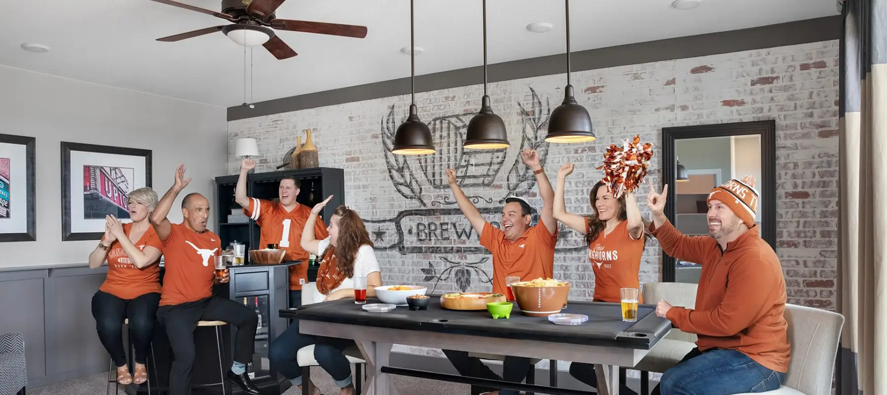 Longhorn fans cheering in tv room